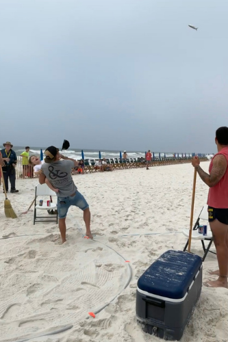 John Radzwilla tosses a mullet with his son