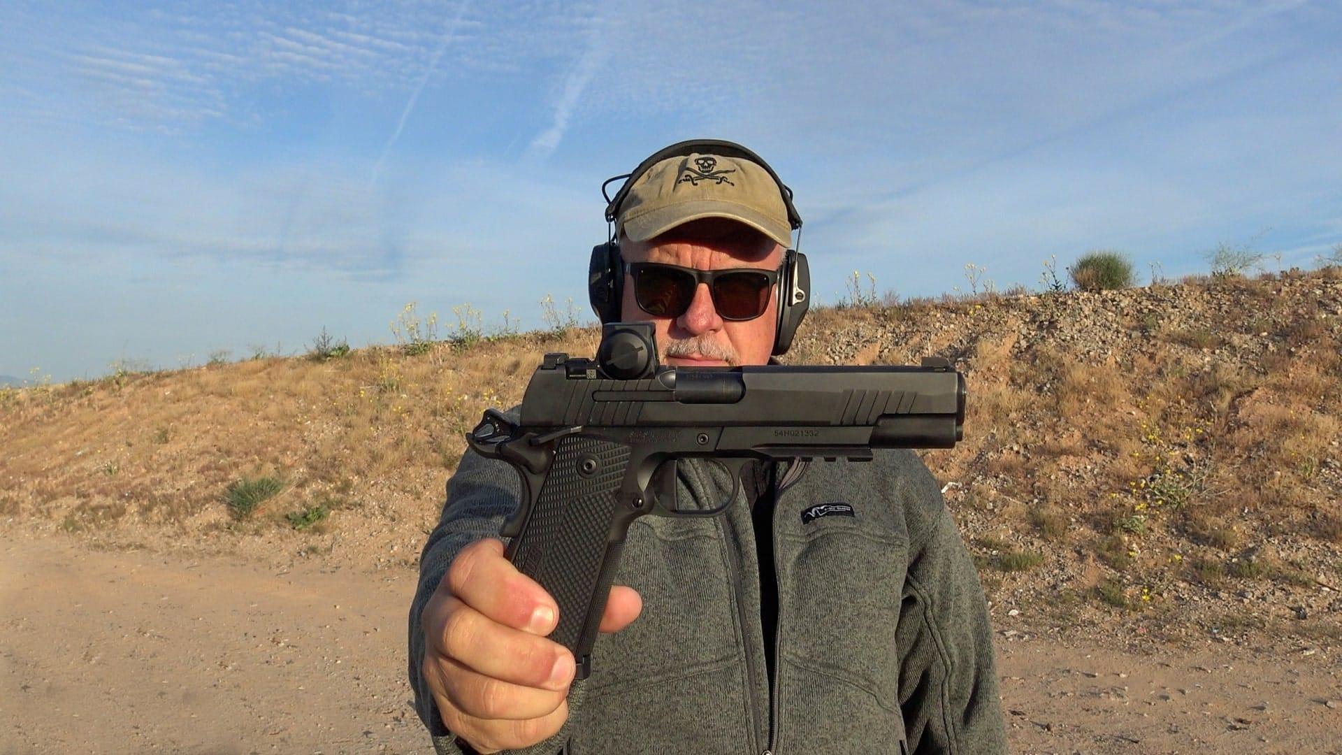 FRED MASTISON HOLDING SIG SAUER XFULL 1911X